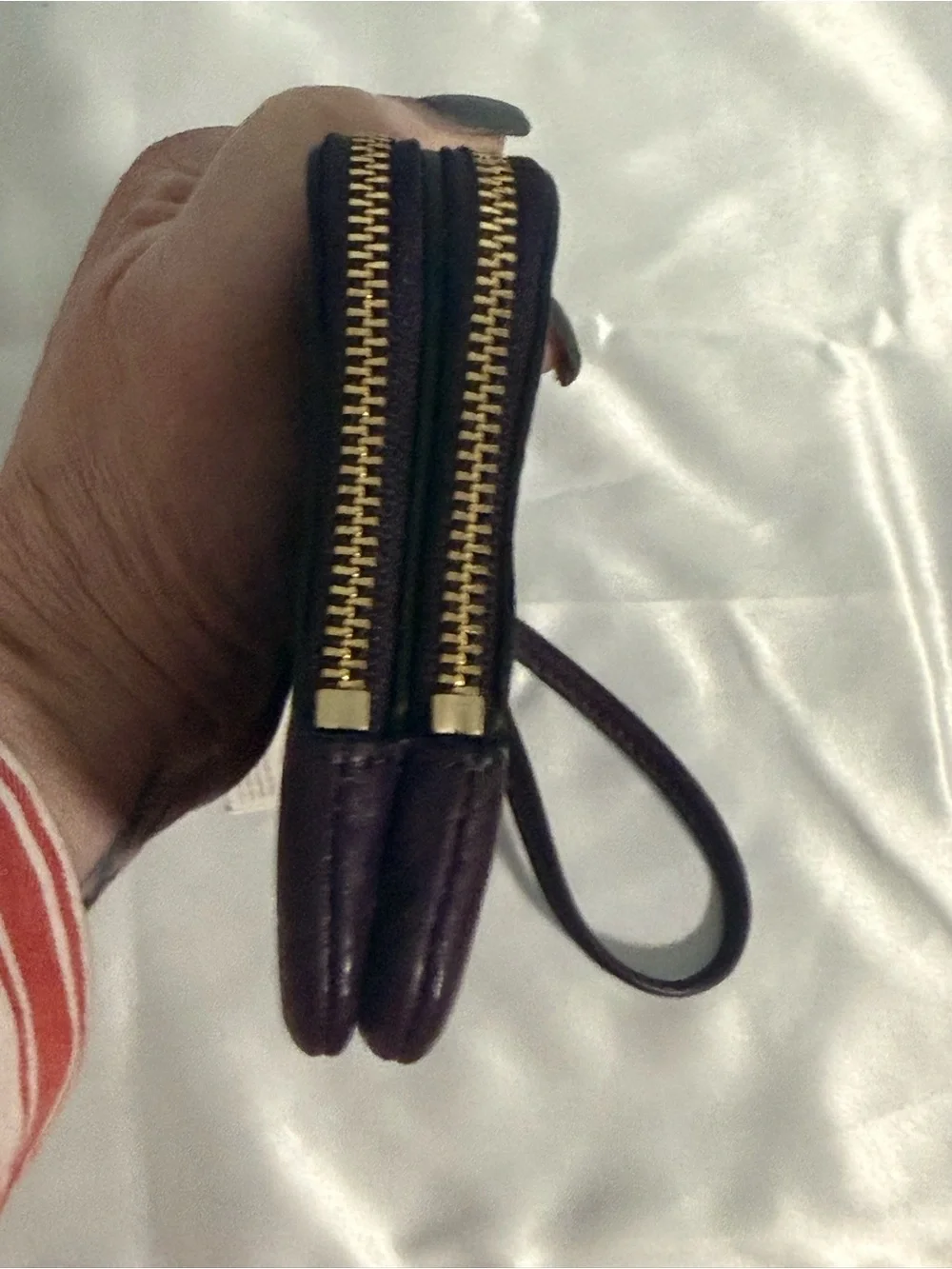 Coach NWT Pebbled Leather Wristlet in Plum w/handtag and two zip compartments.